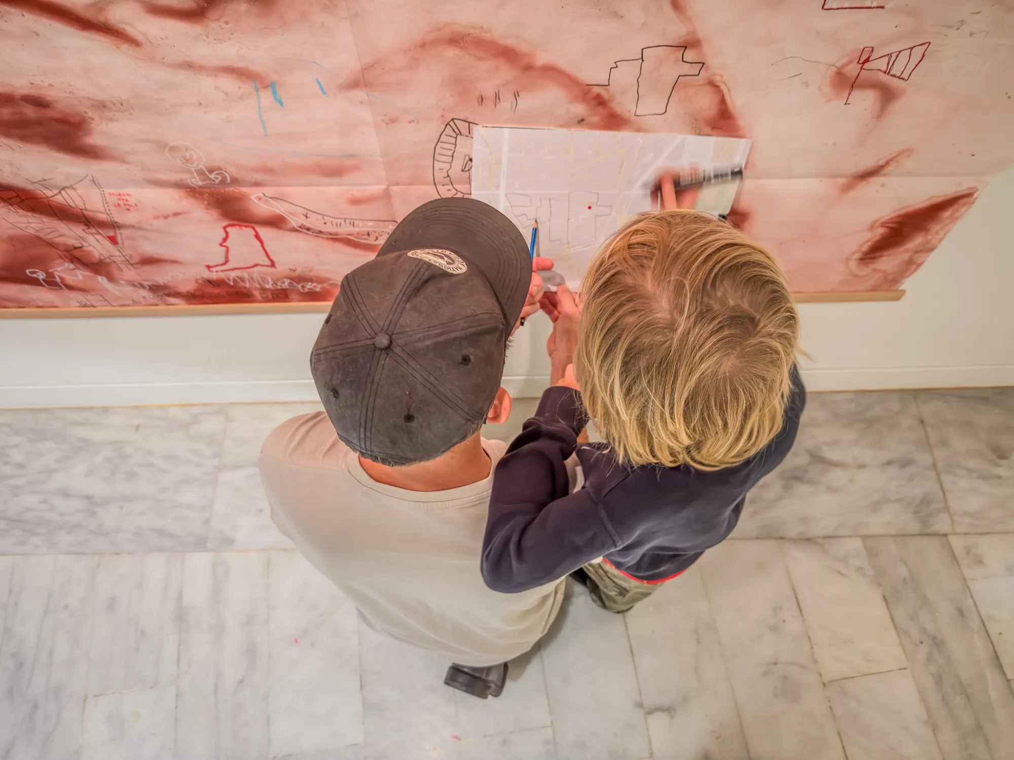 An adult and a child drawing together. Drawing while Walking, Museu Picasso, Barcelona, 2026