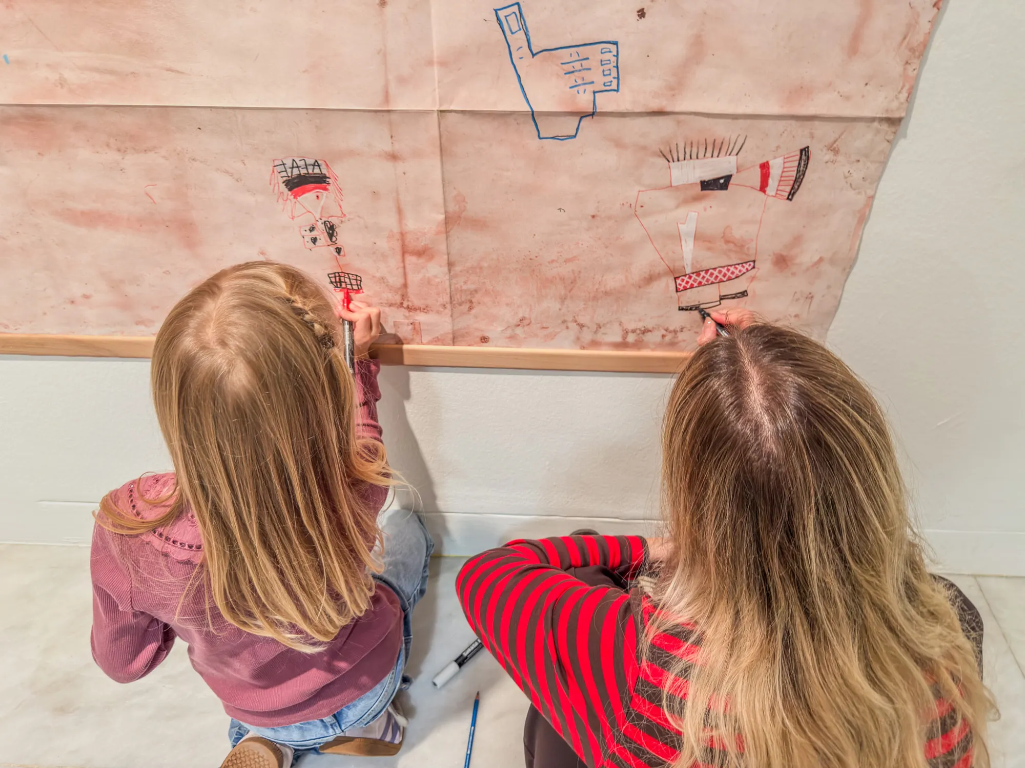 Two girls add their lines to those already there. Drawing while Walking, Museu Picasso, Barcelona, 2026